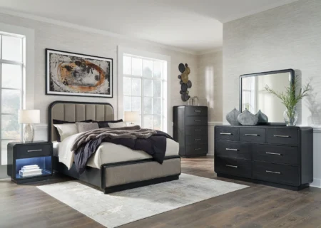 rowanbeck queen upholstered panel bed with mirrored dresser, chest and nightstand