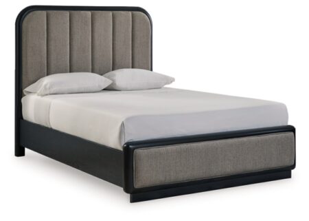 rowanbeck queen upholstered panel bed with mirrored dresser, chest and nightstand